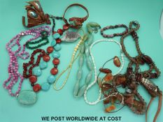 A collection of agate necklaces, ivory necklaces,