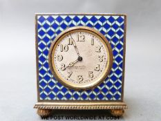 A Zenith 8 day enamel travelling clock with geometric pattern to sides, top and front,