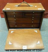 A mahogany tool chest of eight drawers with contents (W46 x H34 x D22cm)