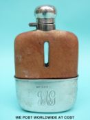 A hallmarked silver mounted hip flask with leather upper cover, bayonet cap and pull off cup,