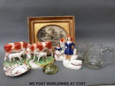 A quantity of ceramics to include Staffordshire cows, gilt framed silk picture,