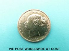 An 1876 Queen Victoria bun head gold half sovereign,