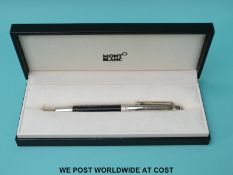 Montblanc Meisterstuck ballpoint pen with chrome cap and clip and engraved black resin barrel,