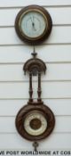 Two circa 1910 aneroid wall barometers, one in turned mahogany dial case,
