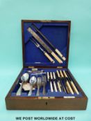 An oak cased Walker & Hall six-place setting canteen of cutlery including carvers,