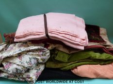 A box containing fabric for clothes/dress making including some navy cord material,