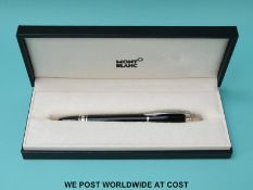 Montblanc fountain pen with black resin barrel and cap, chrome fittings and 18ct gold nib,