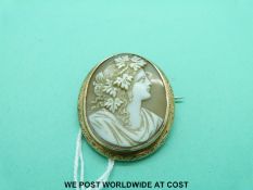 A yellow metal brooch set with cameo
