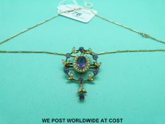 An Edwardian 9ct gold pendant set with amethysts and seed pearls