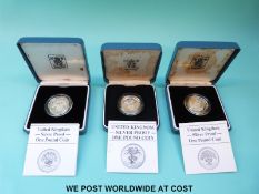 Three cased Royal Mint £1 silver proof coins for 1985, 1986 and 1987,