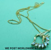 A 9ct gold pendant set with seven teardrop shaped stones, on 9ct gold chain (6.