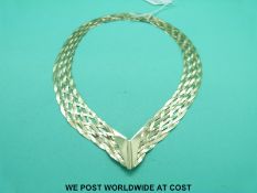 A 9ct bicolour gold necklace of ribbon design (17.