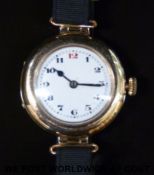 Swiss made 9ct gold ladies wristwatch with blued hands, Arabic numerals and white enamel face,