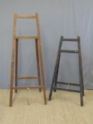 Two wooden easels,