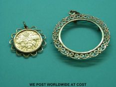 A mounted gilt 1959 sixpence, together with a yellow metal filigree mount with 28.