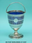 A Georgian hallmarked silver pedestal sucrier with swing handle,