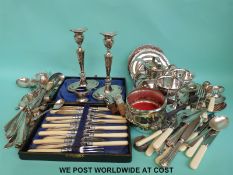 A quantity of silver plate to include candlesticks, Guernsey cream jug,