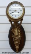 A 19thC wall sconce ball clock, supported by classical female spelter figure,