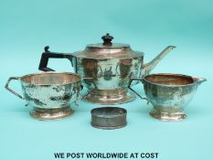 A George V hallmarked silver three piece tea set, London 1923/26, height of teapot 11.