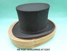 A boxed opera hat by Austin Reed