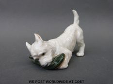 A Royal Copenhagen West Highland Terrier with shoe