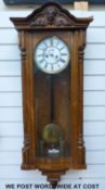A 19th century Vienna regulator wall clock in walnut case the two train movement striking on a gong,