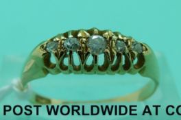 An 18ct gold ring set with five diamonds (size N)