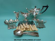 A plated pedestal tea set and a six place setting canteen of cutlery,