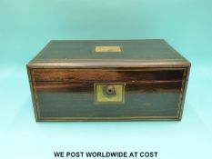 A 19thC Coromandel wood brass bound writing slope with Bramah lock and secret drawers,