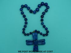 A 19thC Russian cross on a sodalite/azurite beaded necklace.