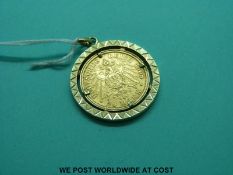 A 14ct gold pendant set with a 1908 twenty mark gold coin (12.