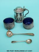 A hallmarked silver mustard with wrythen decoration,