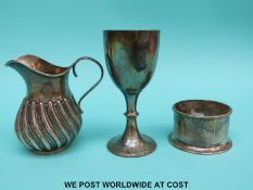 A Victorian hallmarked silver jug with wrythen decoration, Birmingham 1890 maker Thomas Hayes,