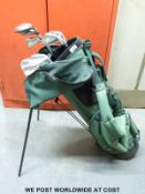 Golf clubs in a bag with a stand