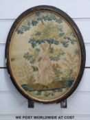 A Victorian / Edwardian embroidery on silk of a lady holding a bird cage,