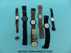 Four Swatch Pop wristwatches together with a similar example and three other watches.
