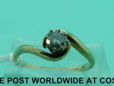 A 9ct gold ring set with a round cut diamond measuring approximately 0.