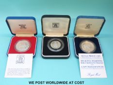 Two silver proof Royal commemorative cased crowns together with a Bank of Zambia 20 Ngwee