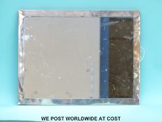 A particularly large George V hallmarked silver mounted mirror,