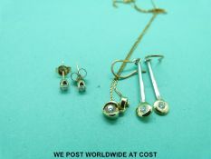 A 9ct gold pendant set with a diamond,