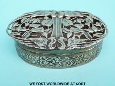 An Edward VII Art Nouveau hallmarked silver trinket box with pierced lid decorated with birds and