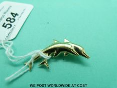 A 9ct gold brooch in the form of a dolphin