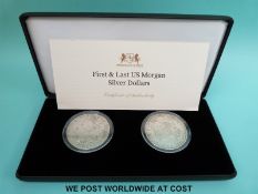 Cased first and last US Morgan silver dollars with certificate of authenticity