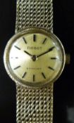 Tissot Stylist 9ct gold ladies wristwatch with black hands and baton markers,
