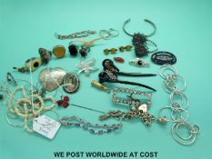 A quantity of silver jewellery to include charm bracelet, necklaces, bracelets, filigree brooch,