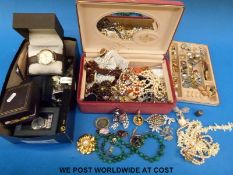 A collection of costume jewellery to include a silver stick pin set with pressed amber,