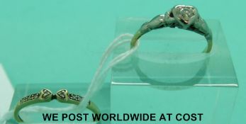 A 9ct gold ring set with diamonds (size R) and an 18ct gold ring set with a diamond in a platinum
