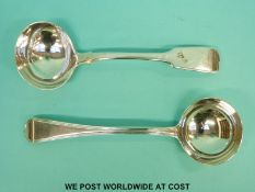 A 19th century hallmarked sauce ladle, London 1824 and a further fiddle pattern example,