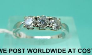 An 18ct white gold ring set with three diamonds, total diamond weight approximately 0.