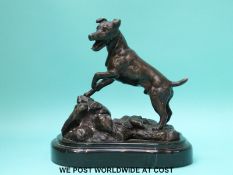 Edouard Drouot (1859-1945) bronze figure of a terrier standing on rocky ground,
